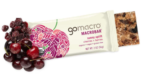GoMacro cherries and berries bar with dried berries and fresh cherries next to the off white package.