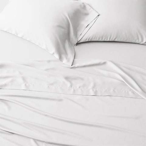 white sheets on bed