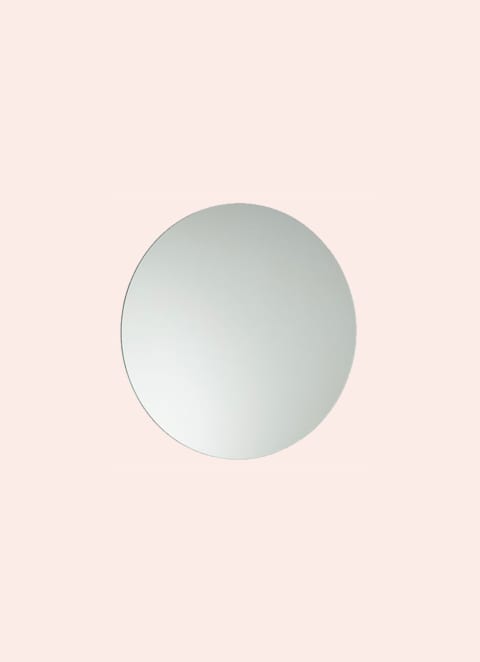 circular mirror on pink background