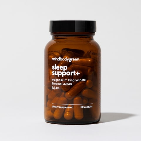 amber supplement bottle with white lettering