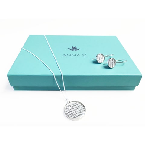 paper necklace over light blue box