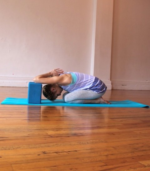shoulder opener on block yoga pose