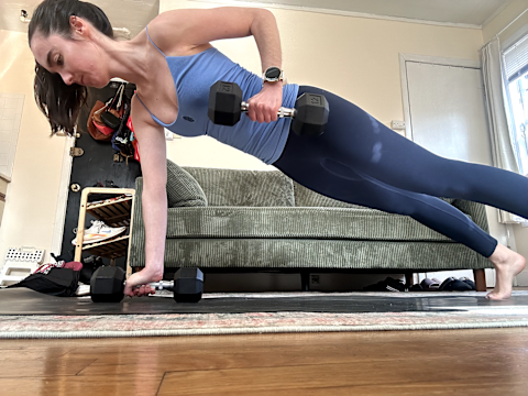 Woman wearing FP Movement activewear while strength training in plank