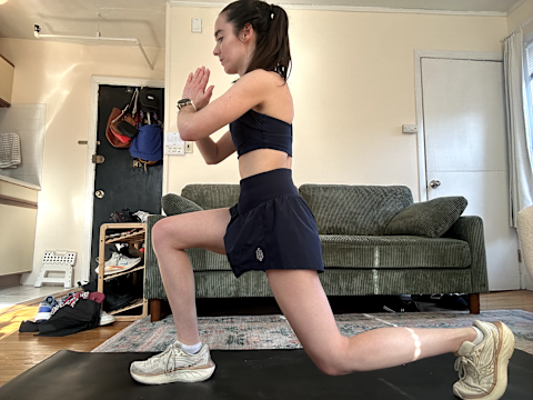 Woman in double squat working out in FP Movement activewear