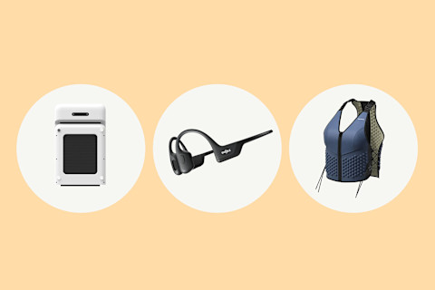 photo of walking pad, shokz headphones, and weighted vest on peach colored background photo of walking pad, shokz headphones, and weighted vest on peach colored background