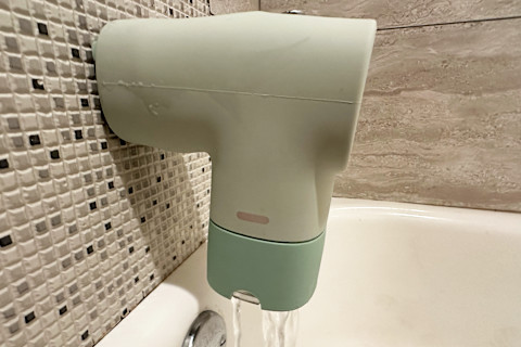 Canopy Bath Tub filter in jade on spout with water indicator changing to red