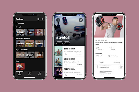 les mills+ interface on phones on background