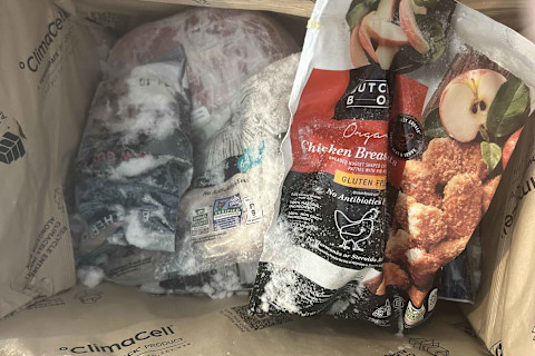 photo of the inside of ButcherBox delivery (ice, frozen meat)