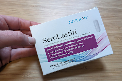 Juvenon Serolastin box held in hand on right side of screen