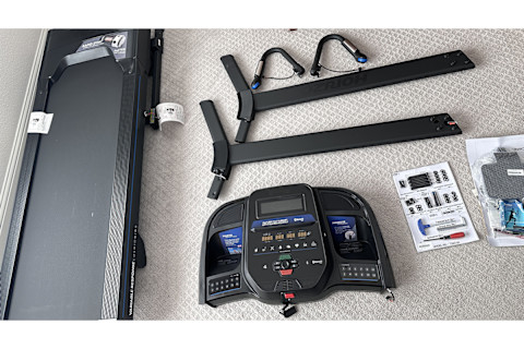 horizon 7.0 treadmill parts unboxed on floor with deck and console