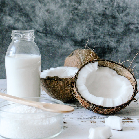 Cut Open Coconut with Coconut Milk and Sugar Cut Open Coconut with Coconut Milk and Sugar