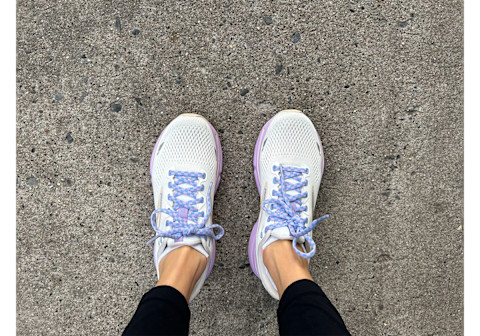 Brooks Ghost 15 Running Shoe Review with white and purple on runners feet on sidewalk side by side
