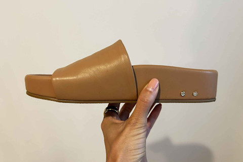 hand holding beek pelican sandal