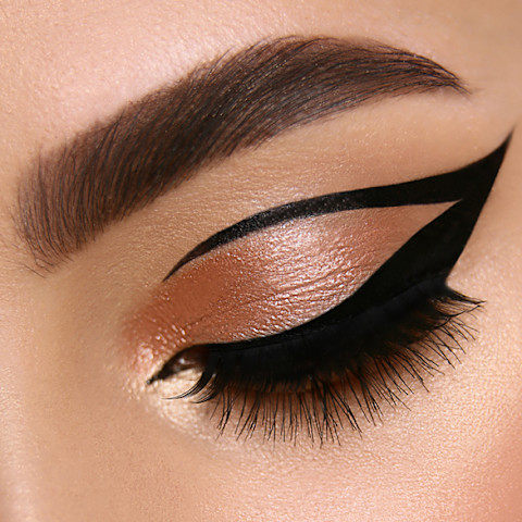 luxury female make-up close-up with eyeliner and golden eye shadow, glamourous cat eye mua, evening style luxury female make-up close-up with eyeliner and golden eye shadow, glamourous cat eye mua, evening style