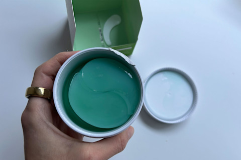 photo of the eye masks in container in writer's hand