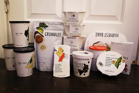 Items in a Daily Harvest box including 4 smoothies, 2 crumbles, 1 scoops dessert, 2 bowls, 2 meal bowls, a bake, latter, and almond milk Items in a Daily Harvest box including 4 smoothies, 2 crumbles, 1 scoops dessert, 2 bowls, 2 meal bowls, a bake, latter, and almond milk