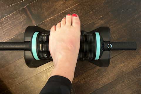 chirp rpm rolling percussive massager in base with foot while turned on