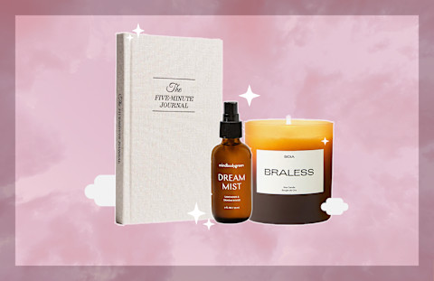 dream mist, journal, and candle on pink background dream mist, journal, and candle on pink background
