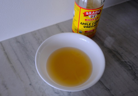 bowl filled with apple cider vinegar and dish soap bowl filled with apple cider vinegar and dish soap