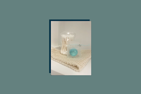 Cocofloss sitting on a bathroom shelf