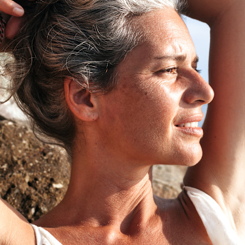 Closeup portrait of a woman with gray hair and fine lines Closeup portrait of a woman with gray hair and fine lines