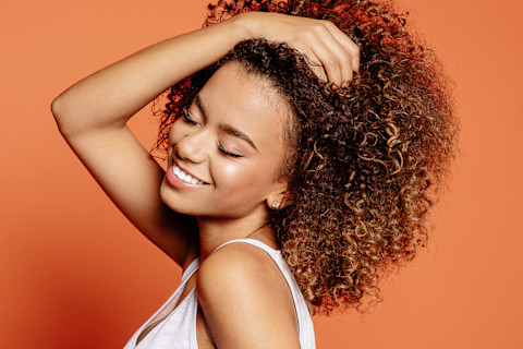 Smiling Young Woman With Curly Hair Smiling Young Woman With Curly Hair