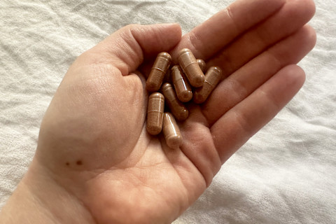 editor's hand holding gaia infinity glow capsules editor's hand holding gaia infinity glow capsules