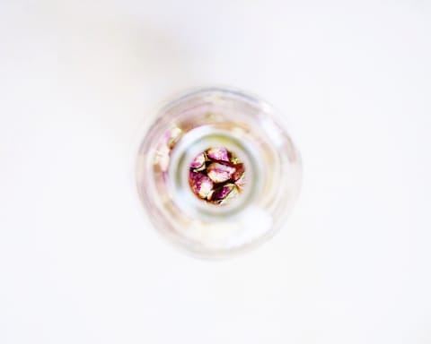 minimal shot from above of jar with roses at the bottom