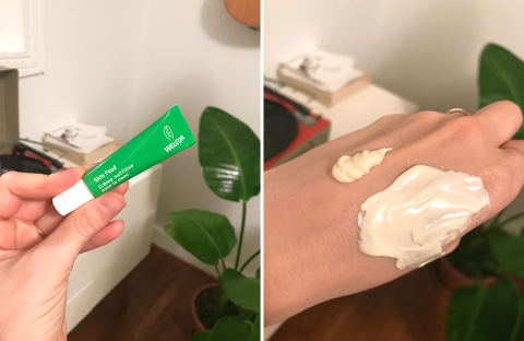 Weleda skin food in packaging and on hand. It shows a thick, cream texture. 