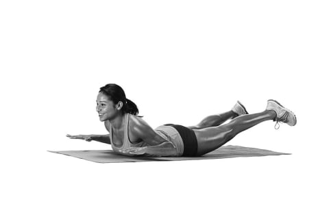 woman demonstrating glute exercise