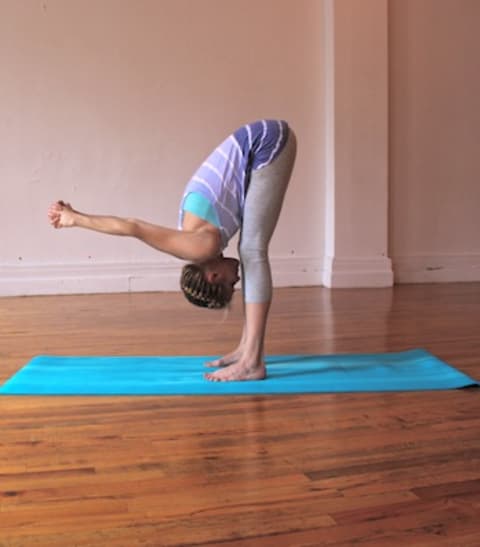 standing forward fold yoga pose