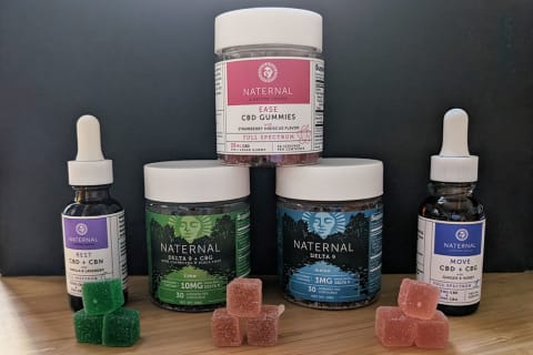 Naternal CBD & Delta 9 products lined up in front of black paper