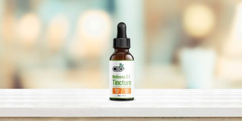 cbdfx wellness 2:1 tincture on white bench