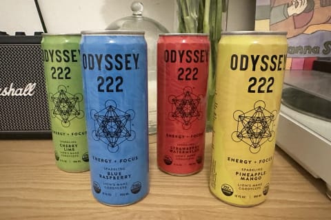 Odyssey Elixir 222 side-by-side with green, blue, red, and yellow can