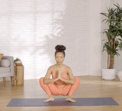 woman demonstrating yoga squat
