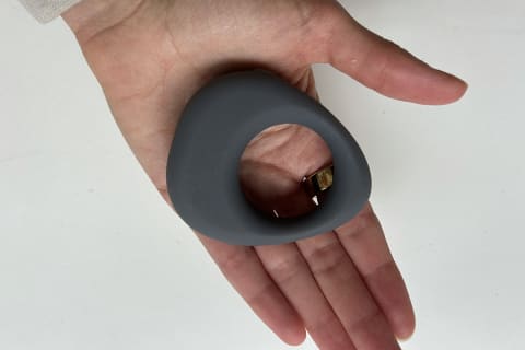 Maude vibrating ring held in tester's palm to see size
