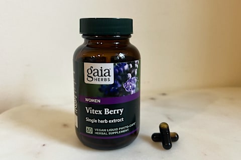 gaia vitex supplement on marble table with two capsules stacked next to it