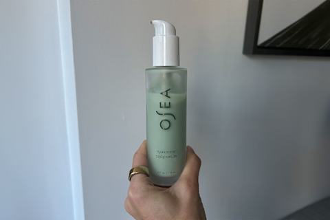 photo of writer's hand holding the osea hyaluronic body serum