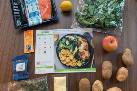 hellofresh ingredients and meal card on table