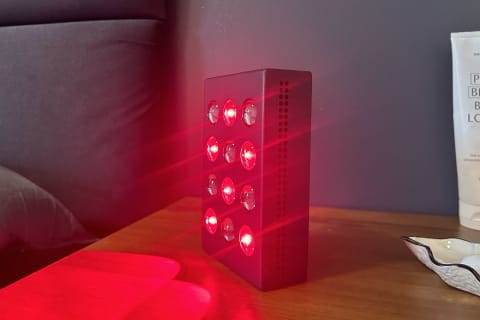 bon charge mini red light lit up on nightstand