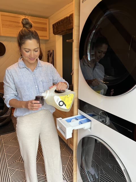 Emma Lovewell washing clothes with 9 elements detergent