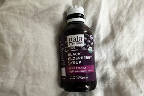 Gaia Herbs Black Elderberry syrup bottle on gray cloth background