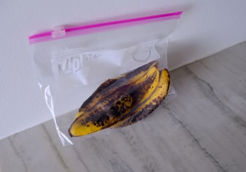 banana in plastic bag on counter