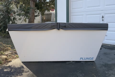 plunge cold plunge tub on drive way with cover on