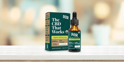 R&R CBD Oil on white bench