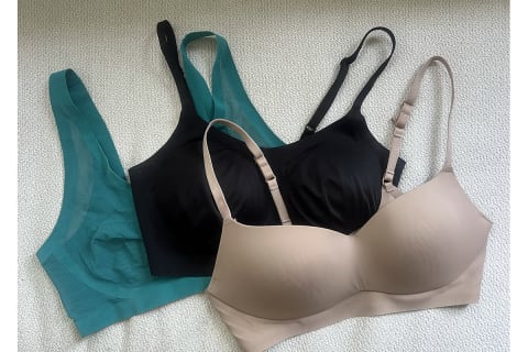 EBY Bralette in peacock, support bralette in black, and balconette in nude on laid flat next to each other