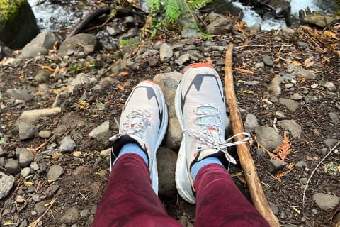 hiking boots next to river