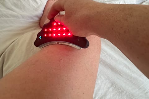 HigherDose Body Sculptor with red light on leg