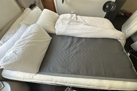Chilipad on mattress to show with sheets pulled back to show pad