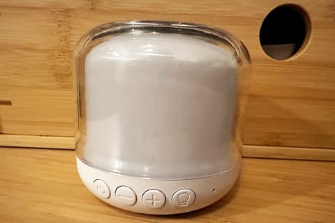 Babelio White Noise Machine with night light in front of woden background turned off light
